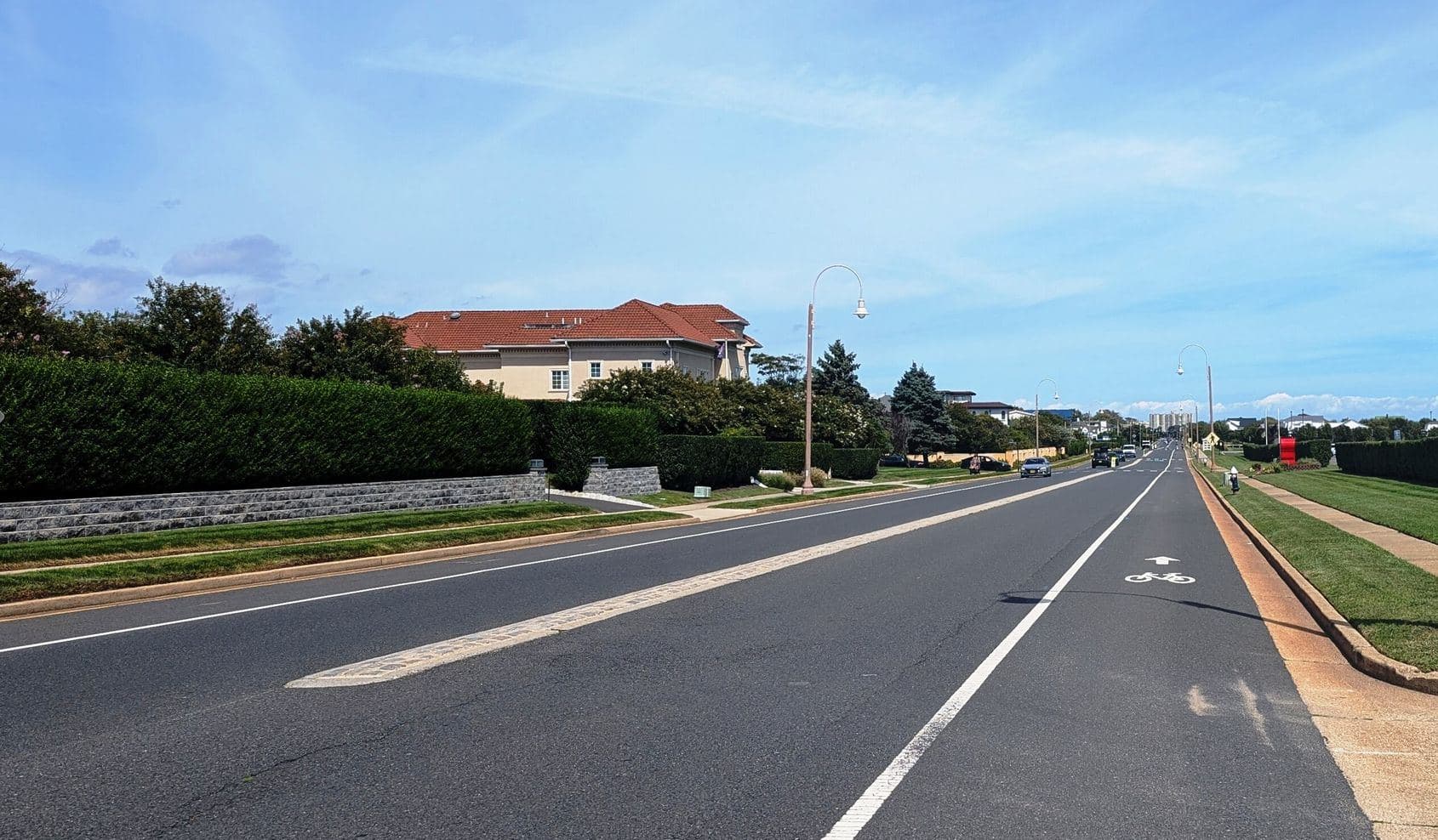 Ocean Avenue in Deal, New Jersey, under a blue sky